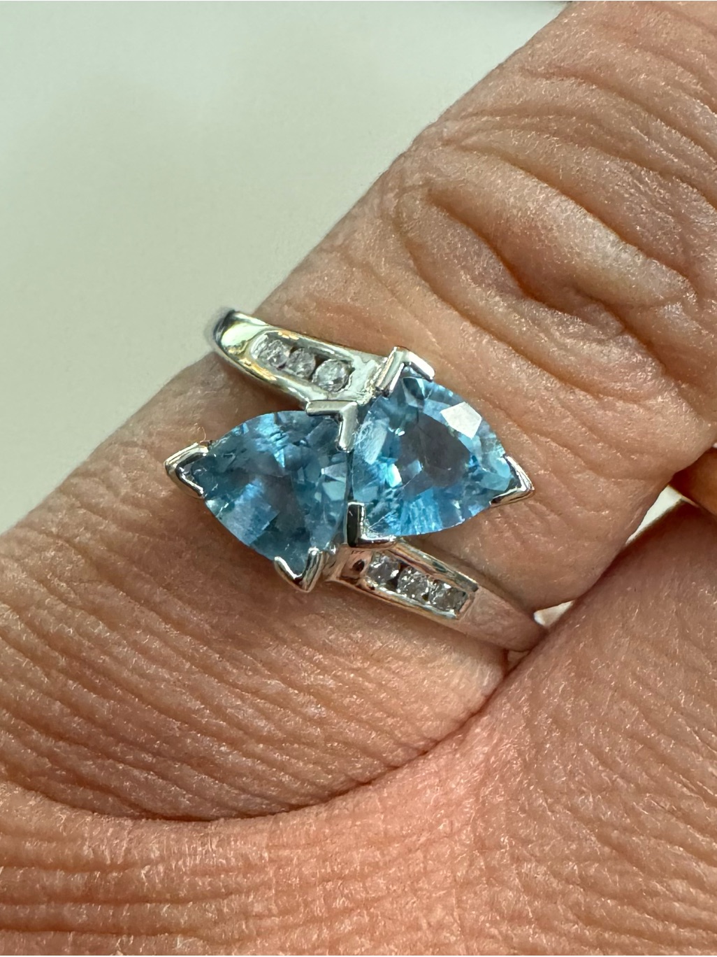 10k White Gold Blue Topaz And Diamond Bypass Ring
